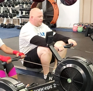 a veteran works out on a rowing machine