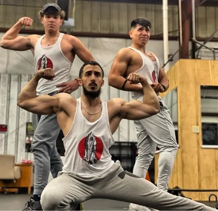 three men flexing their muscles