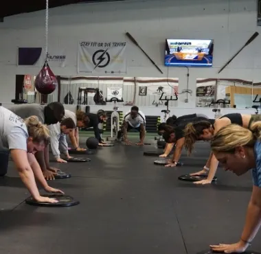 a diverse group of people workout together